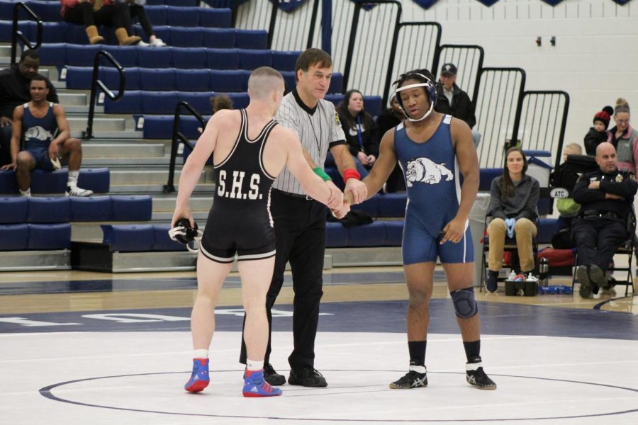 Romjue and his opponent shake hands and congratulate one another after the match is finished. Photograph by Mackenzie Womack.