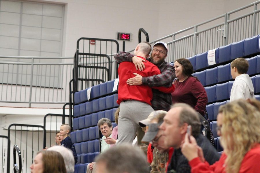 Romjue made his way into the stands to hug his parents who congratulated him after accomplishing this milestone win. Photograph by Mackenzie Womack.