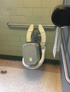 Students placed this trashcan in a toilet. Image Courtesy of: @suckfusky via Instagram