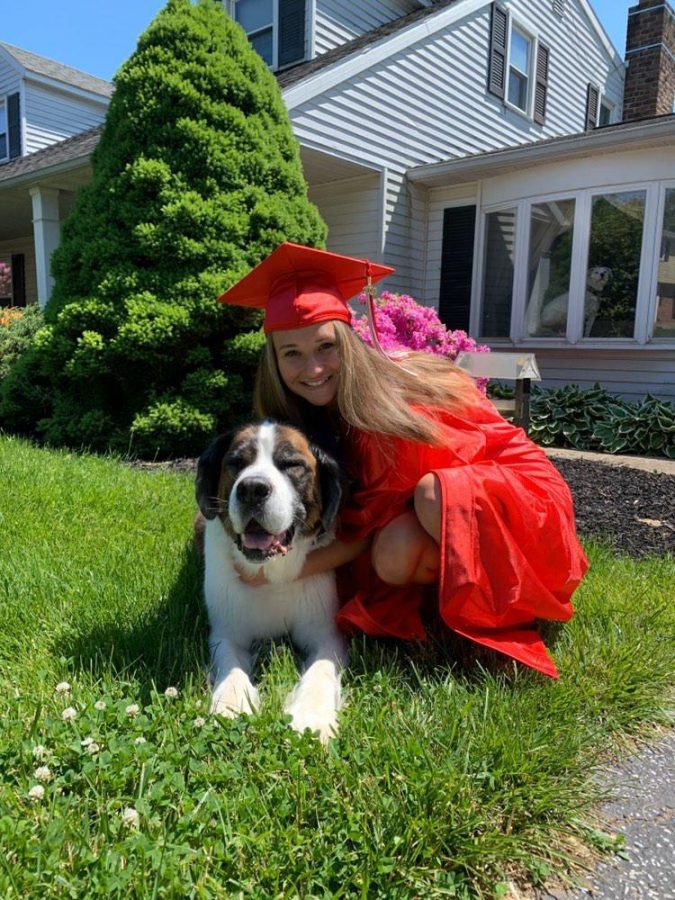 Senior Amber McClure posing for a picture with her dog. I see myself graduated college, pursuing a career in possibly nutrition or animal sciences, said McClure. I would like to work full time at a temporary job while I am looking for a more permanent job. I would love to get my own place, somewhere in the country, hopefully with my friend or significant other. I would also get a puppy when I graduate so I can have something to come home to. Photograph courtesy of Amber McClure.