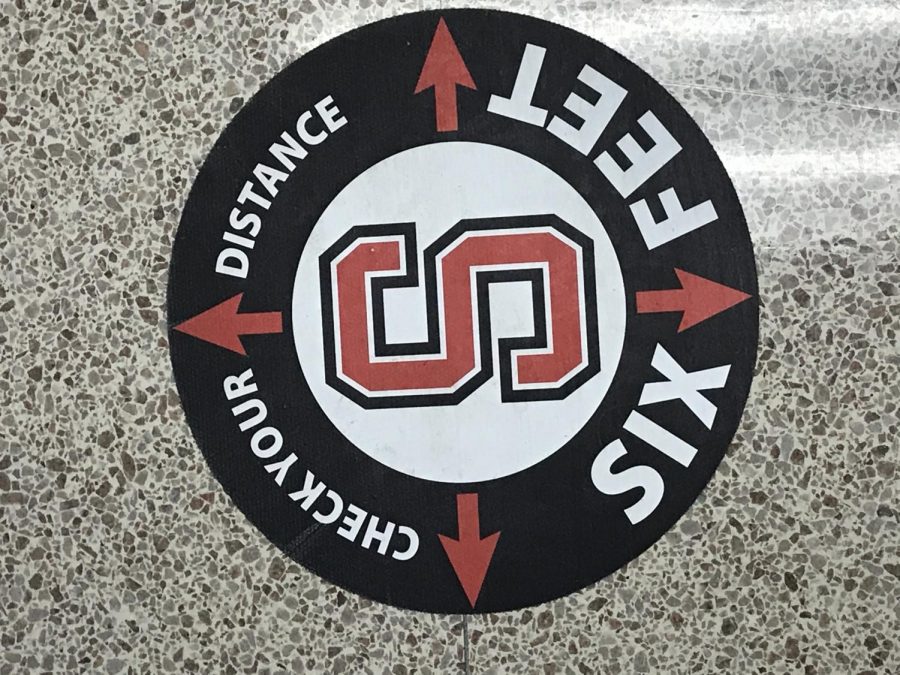 These are the stickers placed on the floor by the hand washing stations, reminding the students of the six feet apart rule. Photograph by  Emily Polanowski