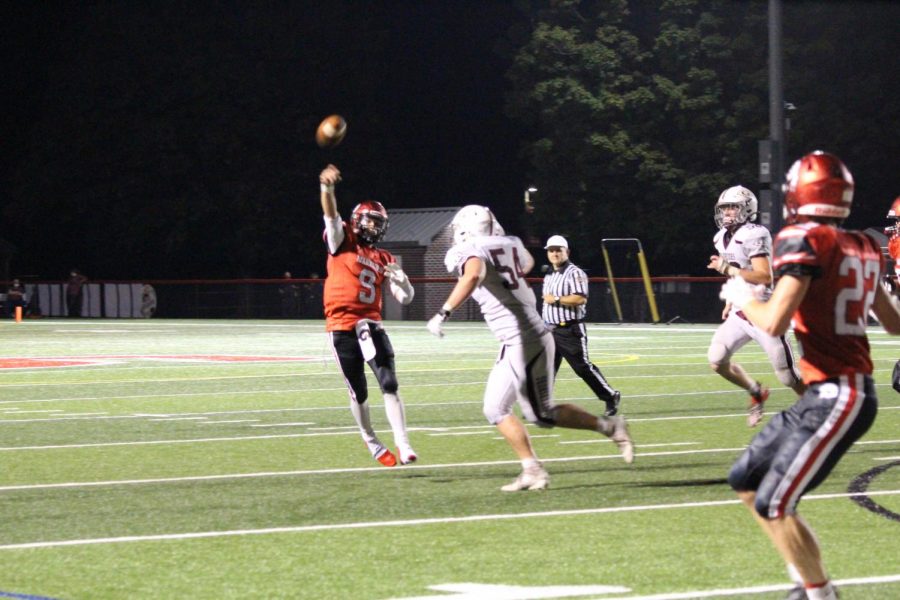 Sophomore Brad Bennett attempts a pass over Gettysburg defenders. Bennett finished the game with 7 completions for 100 yards, 1 touchdown and 2 interceptions. Photograph by KC ONeill