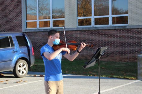Ian Rosul plays the viola   for Smartmusic outdoors. Photo by Elaine Paulk.