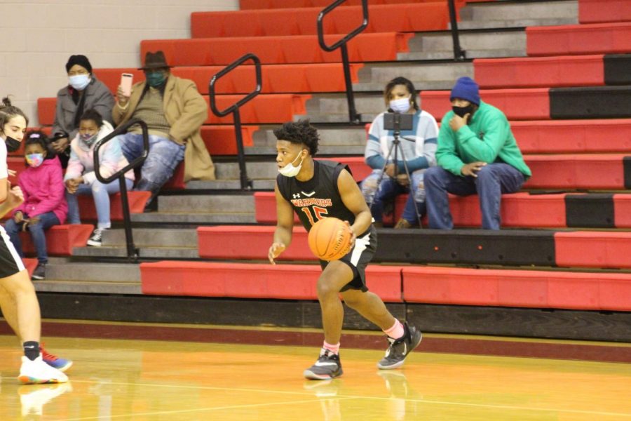 Junior guard Jalen Franklin handles the ball on the wing during the boys basketball team’s game against Donegal on Jan. 9.  He ended the night with 21 points.  Photograph by Lola Sroka 