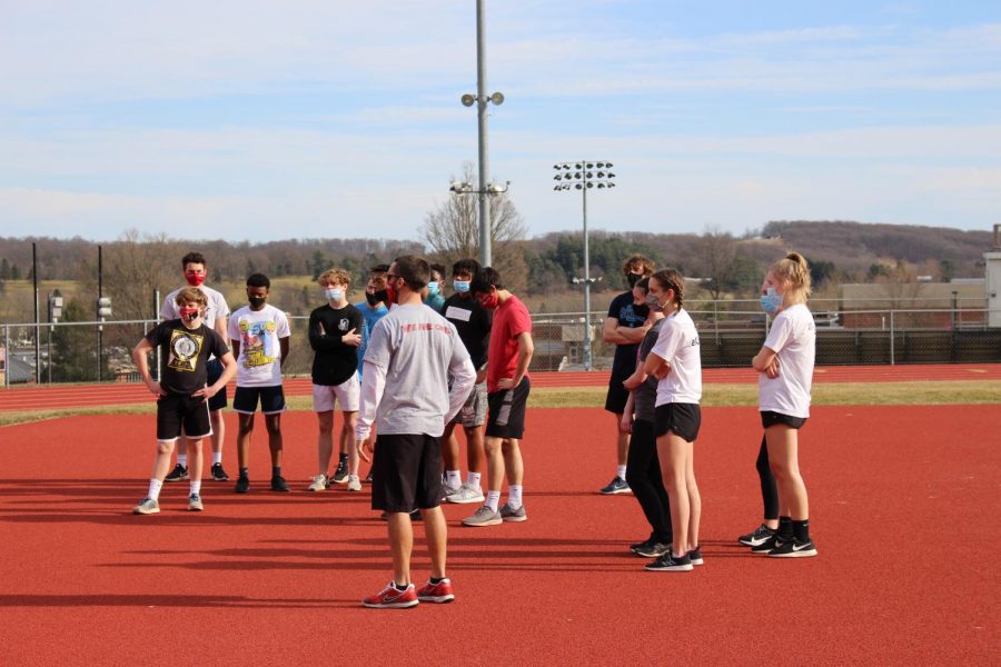 Track Coach Joe Sorice addresses members of the track &  field team prior to their early season practice.