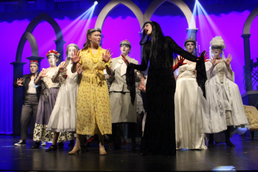 Morticia Addams, portrayed by Greta Hartman, Alice Beinek, portrayed by Juliana Quintillian, and the female ancestors dance together in “Secrets”. A cast favorite, this number features a creative, conversation-like song and dance that keeps the audience engaged and interested in the show. “I am constantly in awe of the talent and creativity of the production team, and that is the reason why I plead with them to come back year after year,” said Jenkins. “They are so great at taking my outlandish ideas and making them concrete -- and in many ways making them better than I ever imagined.” Photograph by Grace Hartenstein