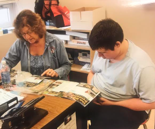 Shearer works with one of her students. Photograph Courtesy of Shearer