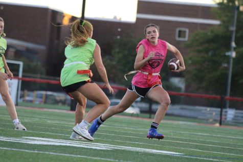 Senior Shelby Derkosh makes her touchdown-scoring run past junior Maggie Grim. Photograph by Alexa Viands 