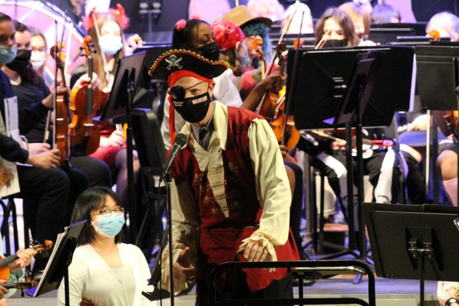 Conductor Zachary Levi introduces the high school full orchestra, dressing as a pirate to follow one of the concert's major themes. The concert itself involved the playing of the high school and the middle school full orchestra students. Photograph by Alexa Viands