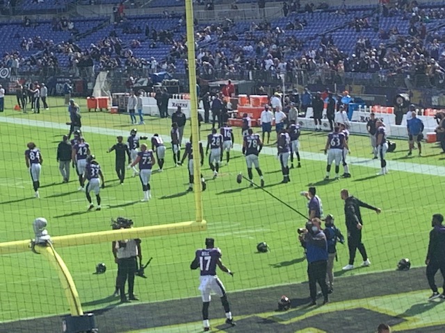 The offense warming up including veteran running back Latavius Murray who suffered an ankle injury in this game. Photographed by