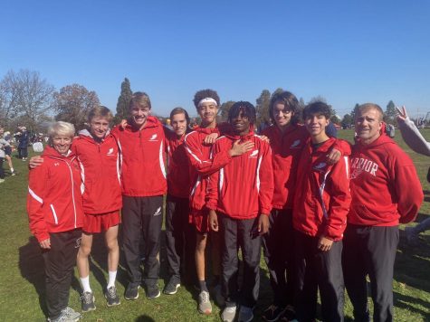 The boys cross country team pose after finishing 8th at the state championship meet in Hershey on Nov. 6.