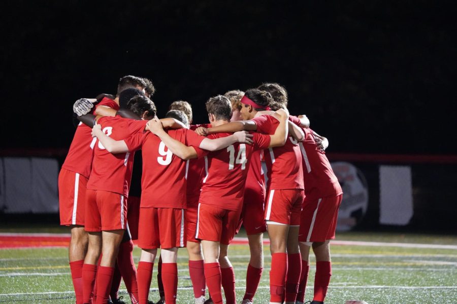 The Boys huddle before their final home game of the regular season. Photograph by Naber Photography. 