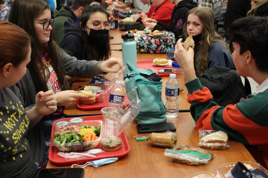 Sophomores eat packed and school lunch in the cafeteria. Photograph by Jewel May.