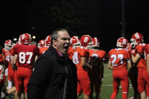 Athletics Director Brad Keeney gets excited about the game. Photograph by Holly Mullaney