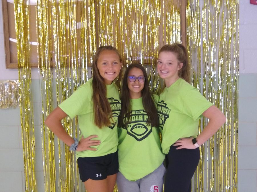 Juniors Nicole Dauberman, Haley Hebel and Alexa Reider show off their class spirit by wearing green for class color day on Wednesday, Sept. 29. Freshmen students were to wear blue, Sophomores were to wear purple, Juniors were to wear green and Seniors were to wear pink on class color day. Photograph by Alex Stine