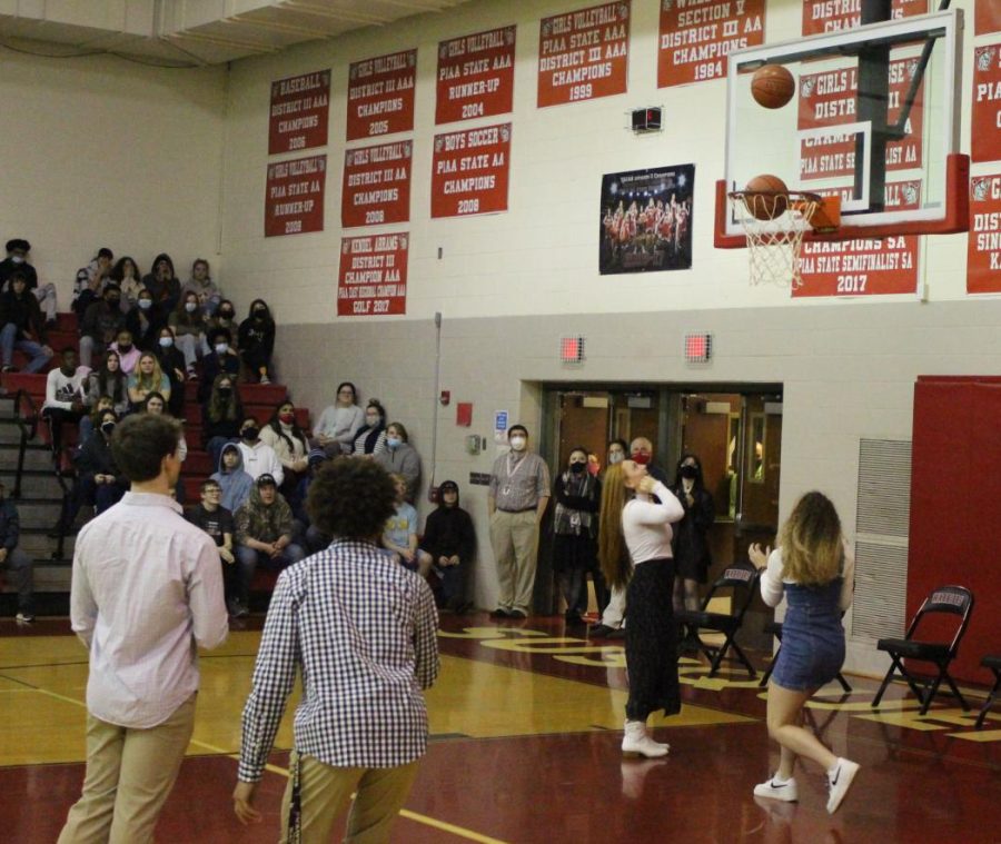 Diggs and Badour compete in a round of knockout during the pep rally, both making close shots. Photograph by Jacob Stroh