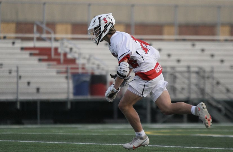 Freshman Grant Johns running down the field.  Photograph by @brookebosphoto via Instagram