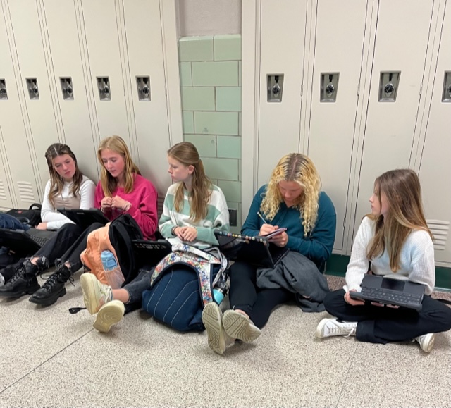 Members of the literary magazine meet during period 11 outside of adviser Tim Groths room. Photography by Katie Ball 