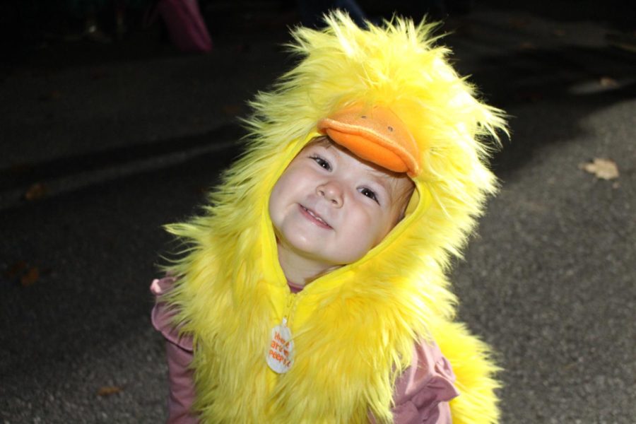 A+little+girl+in+a+fluffy+duck+costume+enjoys+October+Fun+Night.+Children+enjoyed+music%2C+flag+tossing%2C+candy%2C+and+all+the+costumes.+Photograph+by+Katie+Ball