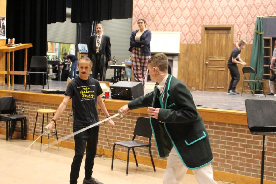 Seniors Kyle Tabak and Kyle Billings engage in a rapier duel during fight call in preparation for the shows during the weekend of Nov. 18.  This is not Tabak’s first time wielding a sword, as in “The Three Musketeers” rapiers were also utilized.  “It was cool and fun,” Tabak said. “Especially when Billings had to change his sword and I then was holding it wrong.”