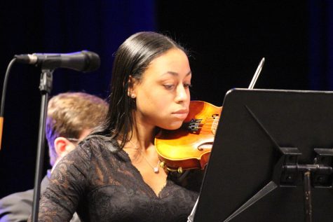 Senior and Concert Master Makani Ross plays the violin. Ross contributed many solos during the orchestra concert. Photograph by Jacob Stroh