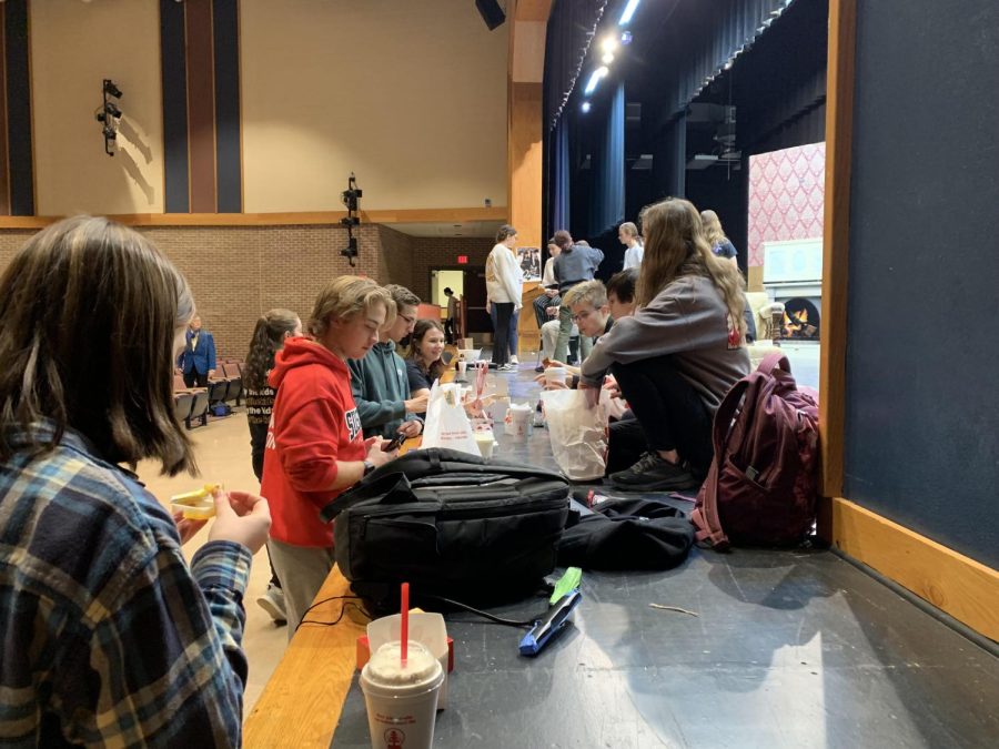 Theatre tech crew enjoy their weekly Chick-Fil-A meal.  Last year food orders would begin happening after a table was built for the Lighting and Sound team, during the techweek practice shows this has become a common tradition.
Photo Credit Brennan Ledesma