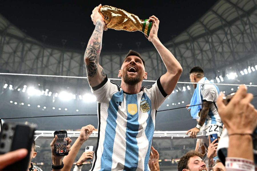 Lionel+Messi+victoriously+holds+up+the+sacred+World+Cup+trophy.+Photograph+Courtesy+of+Lionel+Messi+via+Instagram