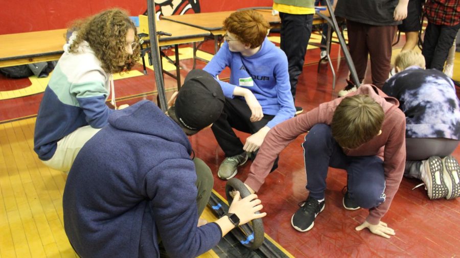 Freshman Eli Allison, Cooper Friendly, Patrick OBrian, and Jacob Iwanowicz work together to build a roller coaster.  
Photograph by Kate Ball