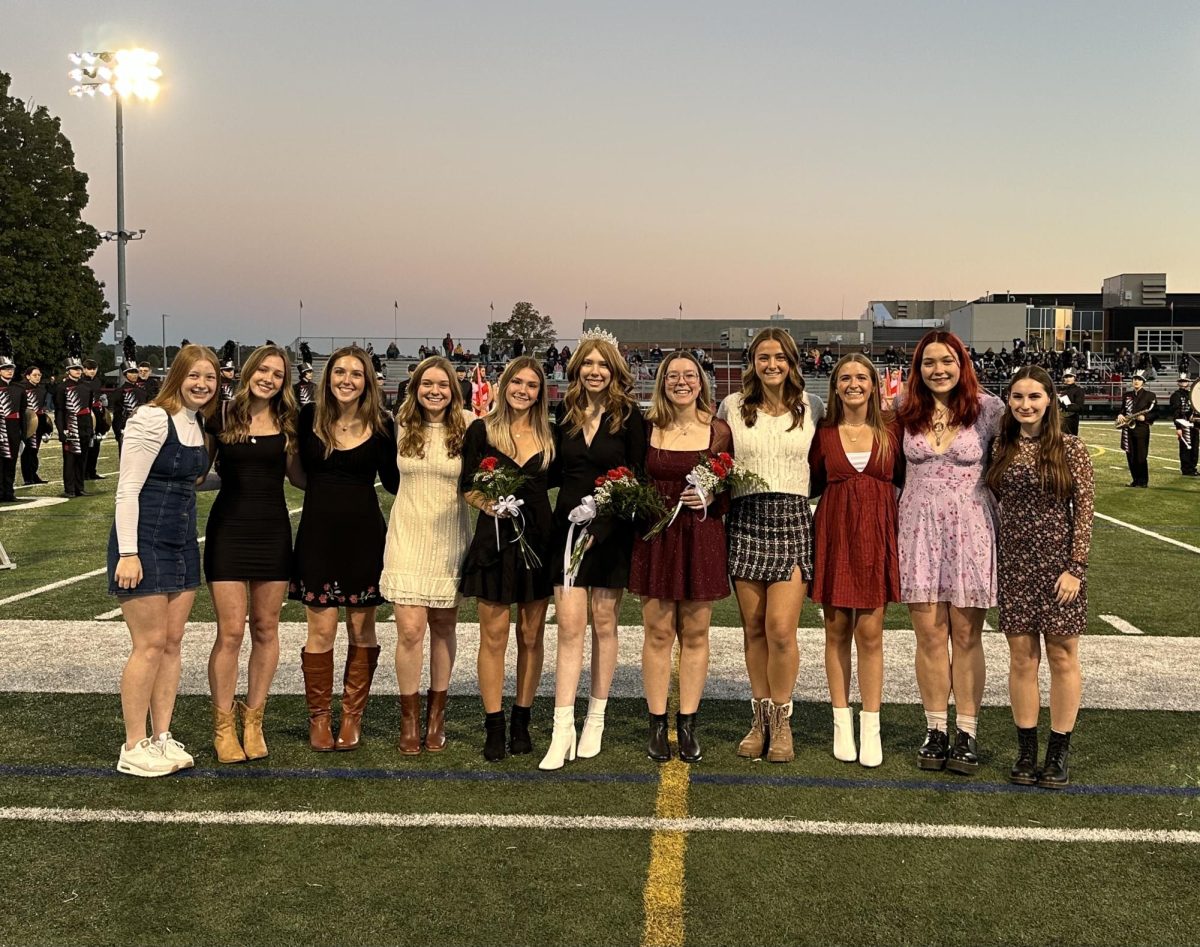 The+Homecoming+Court+on+the+football+field+on+October+13+for+the+annual+Homecoming+football+game.++Keira+Woods+was+announced+Homecoming+Queen+with+Caroline+Dumm+being+first+runner-up+and+Lilly+Wojcik+being+second+runner-up.++%0APhotograph+Courtesy+of+Andy+Warren+