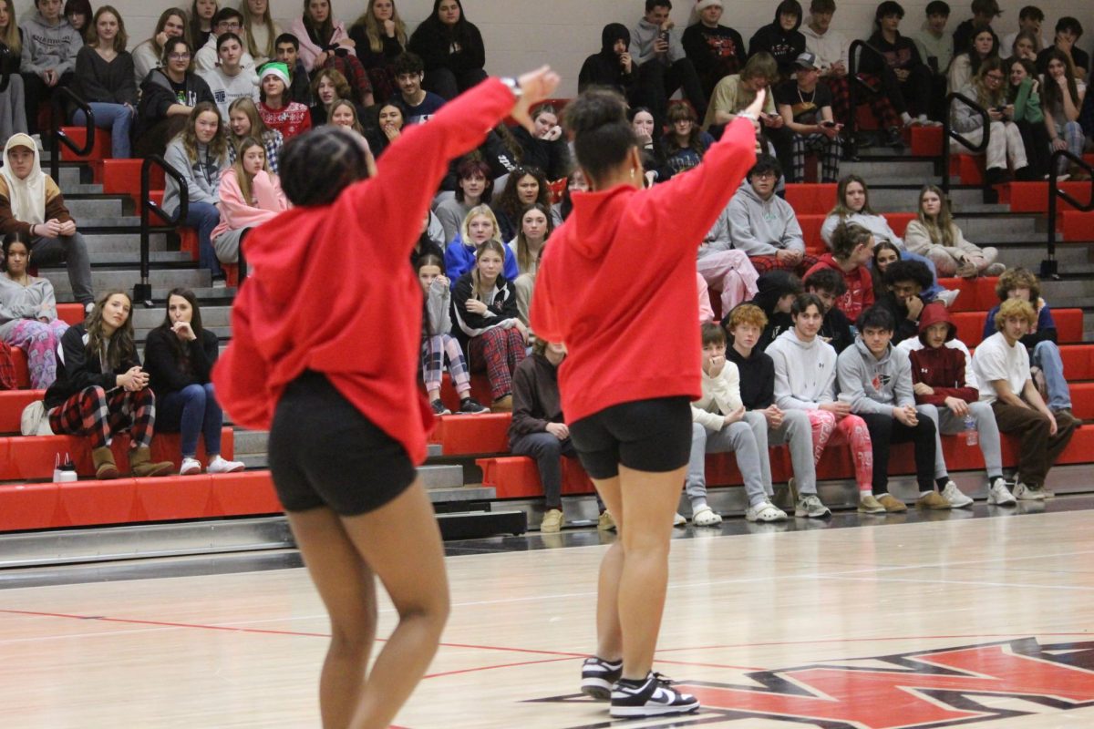 Holmes and Jones  perform part of their routine at the Winter Olympics pep rally on Dec. 22. Jones notes that leading a team of passionate steppers is an important experience for her. “I feel like it’s a good responsibility and something I like to do and I will continue to do it, because it’s something I love,” Jones said. 
Photograph by Kendall Single