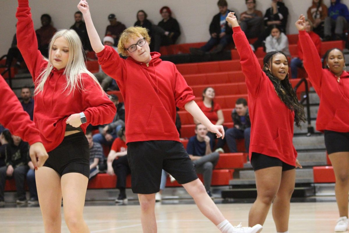 (From left to right) Sophomore Saylor Wheland, sophomore Ethan Steuernagle and sophomore Jastegia Negron perform part of their routine at the Winter Olympics pep rally on Dec. 22.. 
The group of steppers shows their performances during sporting events. “We perform during every other home basketball game,” Jones said.
Photograph by Kendall Single