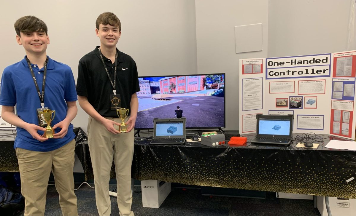Brayden Rathell, on the right, and Hunter Smith, on the left, with their one-handed controller. Photograph taken by JC Lewis. 