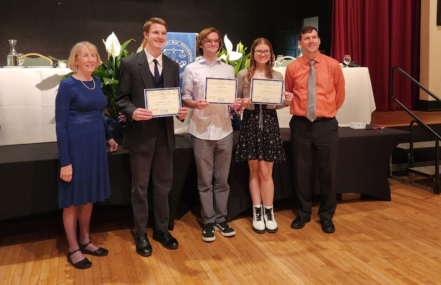 Senior Madison Pisarski, and history teacher Posner, have a far off show with the 3 other winning students at the York Country Bar Foundation law essay Contest. Photograph Courtesy of Paul Pisarski