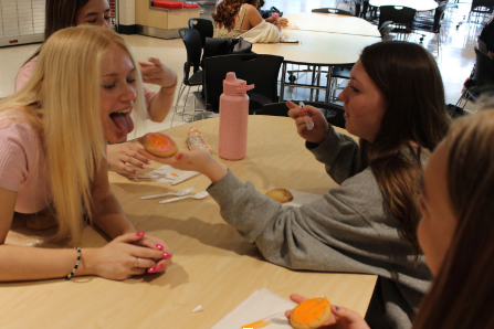 Adrianna Shields, Bella Cook and her friends enjoying cookie decorating.