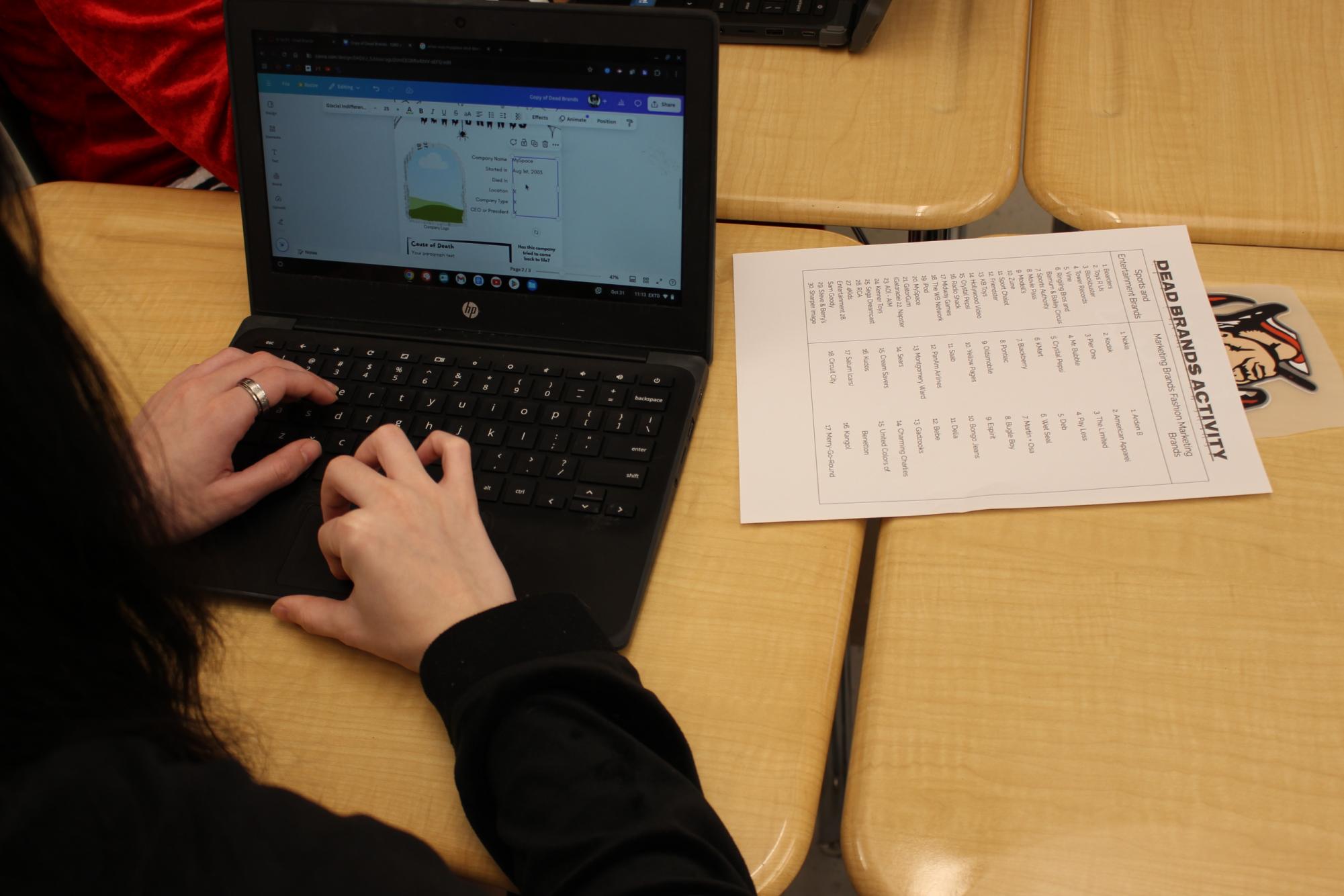 Junior Endiigo Swindell works on a dead company analysis assignment. Students will eventually compare the Susky Station to being a dead company that is attempting a revitalization. Photograph by Nathan Feeser