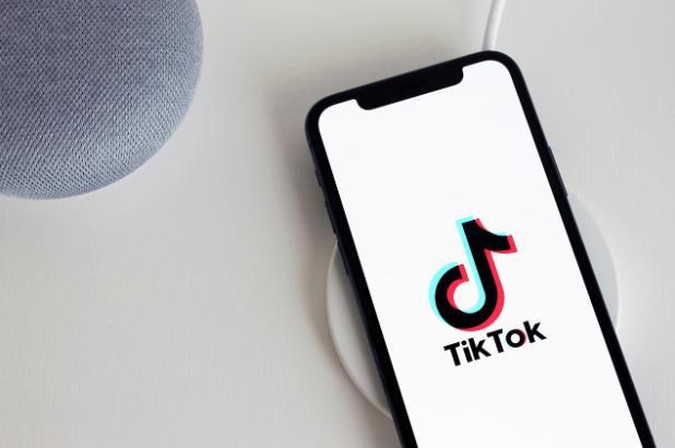 Image of a charging phone with the TikTok logo plastered on.