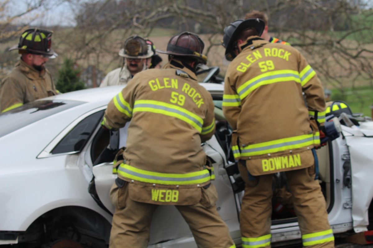 Firefighters use the “Jaws of Life” to cut off the door to the vehicle so that they can safely get the patients out of the car. 
The "Jaws of Life" are crucial because they are hydraulic rescue tools used to extricate people from accidents, particularly those trapped in vehicles or collapsed buildings. Photograph by Peyton Elmore 
 