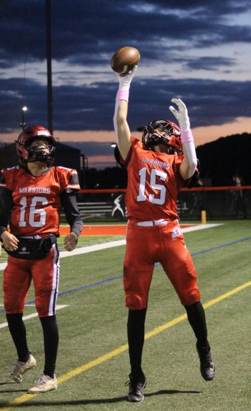 Players warm up on the sidelines prior to the game against the Eastern Knights. 
Photograph by Josie Witsik
