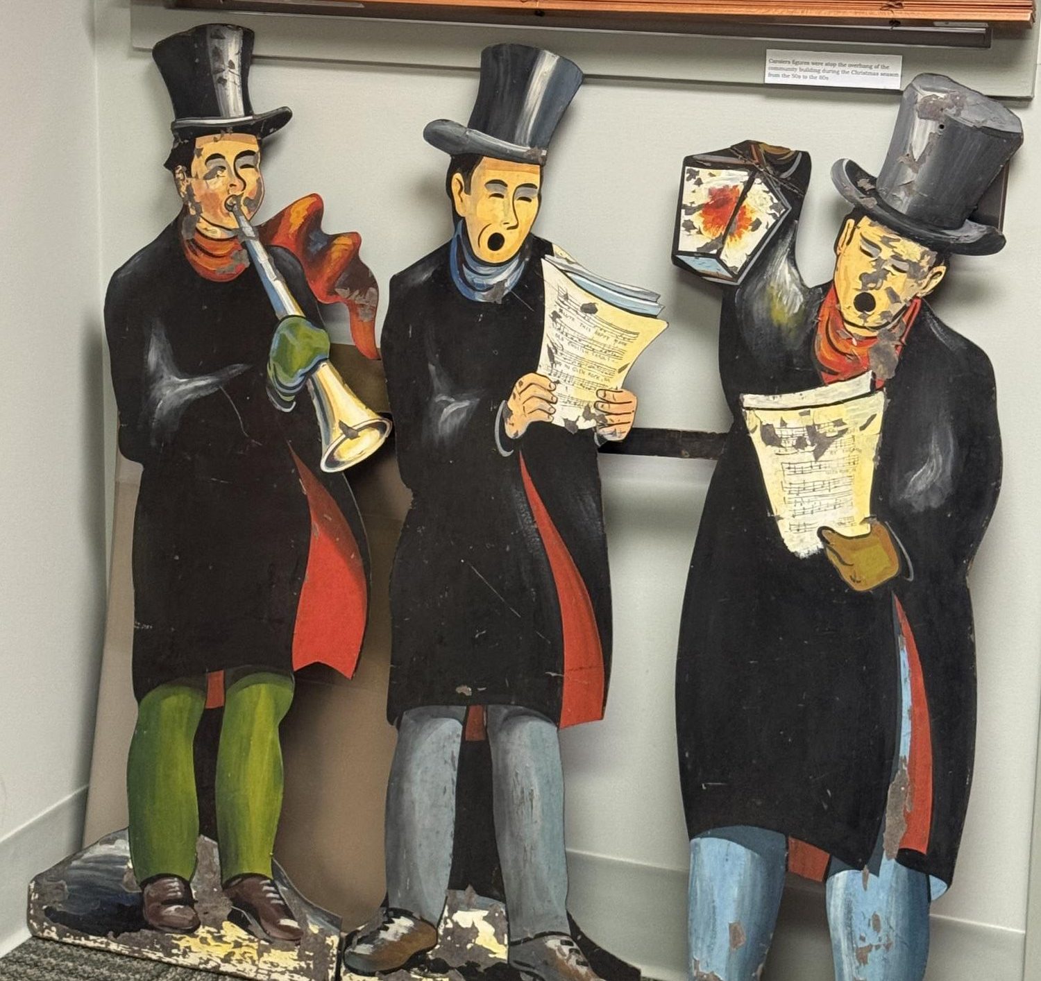 Three Glen Rock carolers depicted singing early Christmas morning, a tradition the community gathers to listen to each year. Photograph courtesy of Audra Cabrera