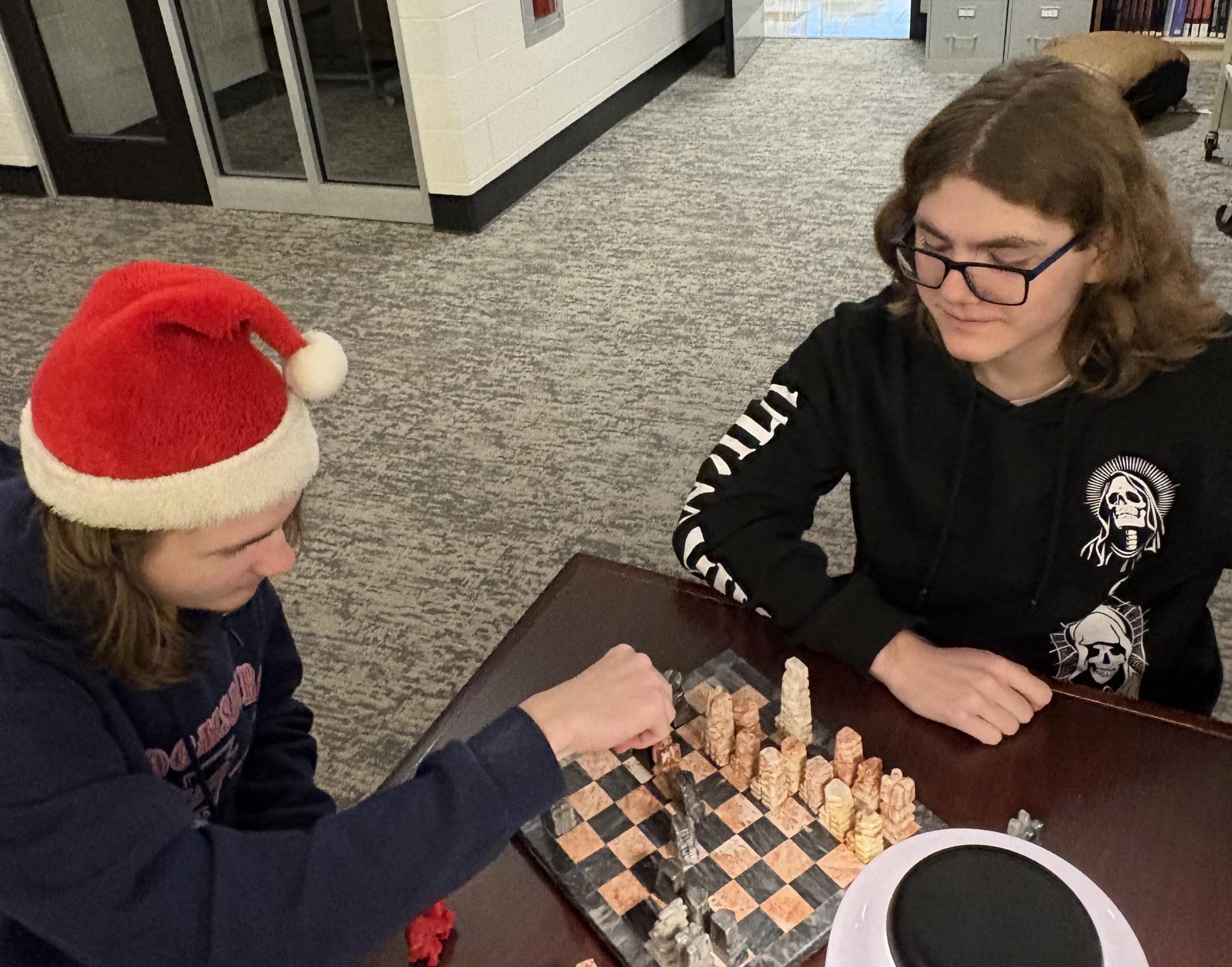 Jonathan Walker makes a move against senior Alec Baublitz in the library. 
Photograph Jonathan Nocar