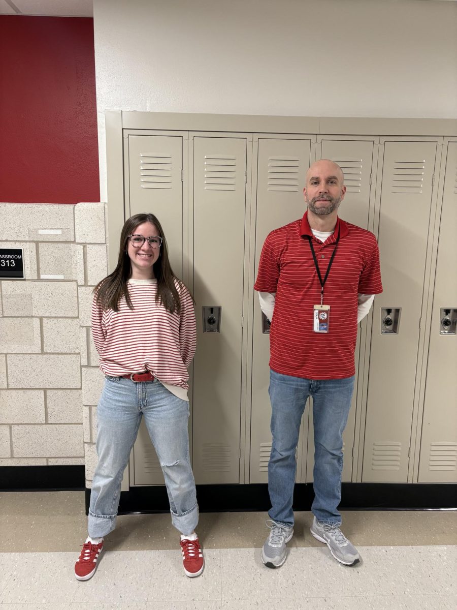 The unexpected duo of junior Aubrey Coleman and math teacher Steward Heikes sport their red and white for ‘Candy Cane Day’ of spirit week. Student Council organized the spirit days to run from Dec. 15-23. Photograph by Caroline Simpson