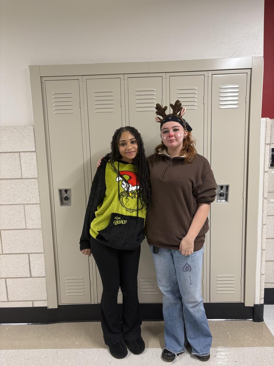 Sophomore Amaree Martin and sophomore Alice Raffensberger radiate school spirit on ‘Winter Character Day’ on Dec. 18. This theme encouraged students to wear an outfit related to different fictional characters associated with the holiday season. Photograph by Caroline Simpson