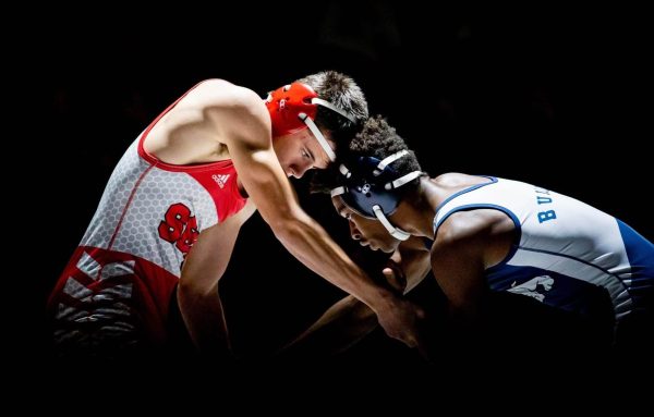 Sophomore Ian Bailey in a wrestling match under the spot light.
Photo courtesy of Korrina Harmis