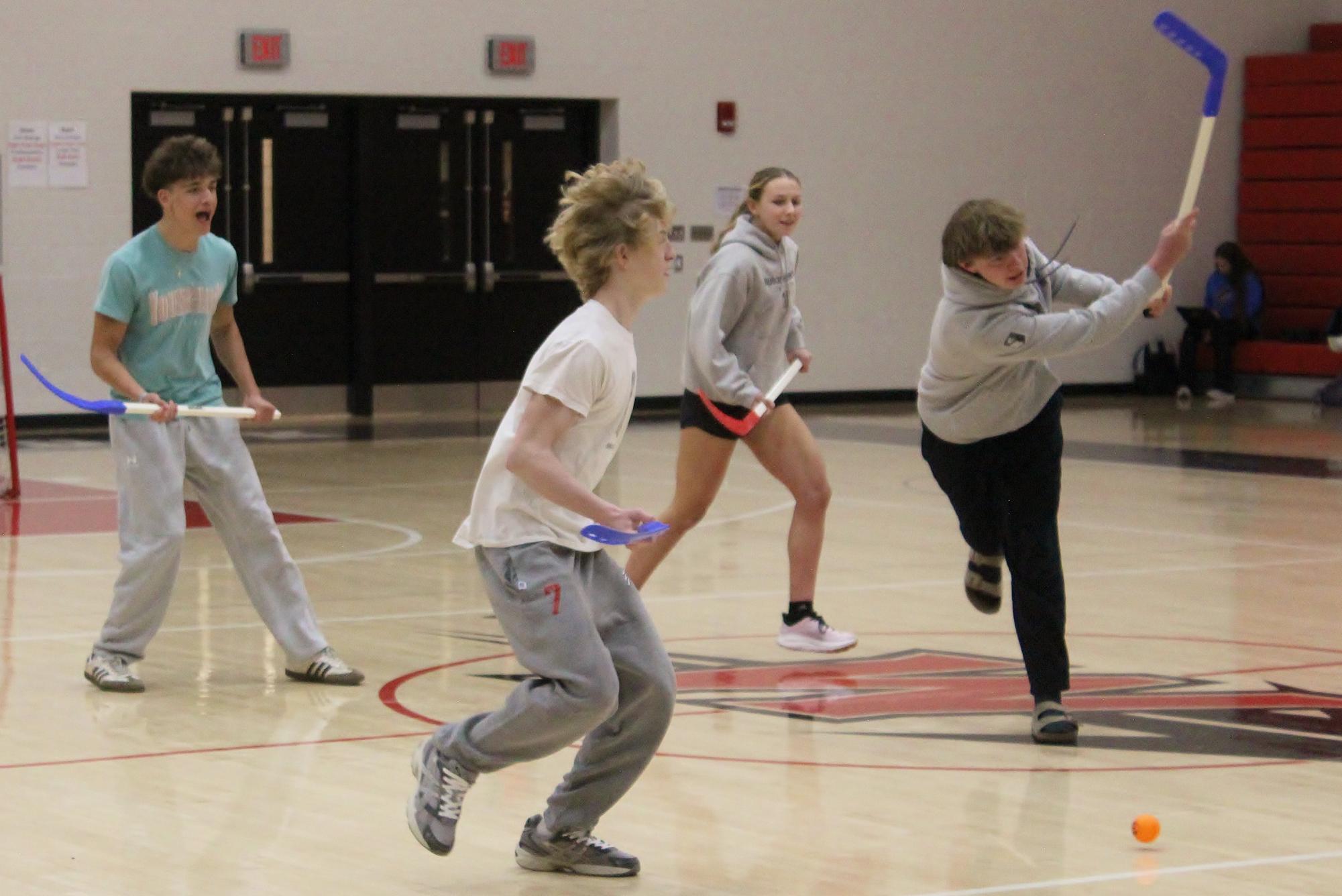 Junior James Parks shoots that ball across the floor as juniors Nikolai Graham, Samuel Bella and Callie Shue follow. Photograph by Nathan Feeser