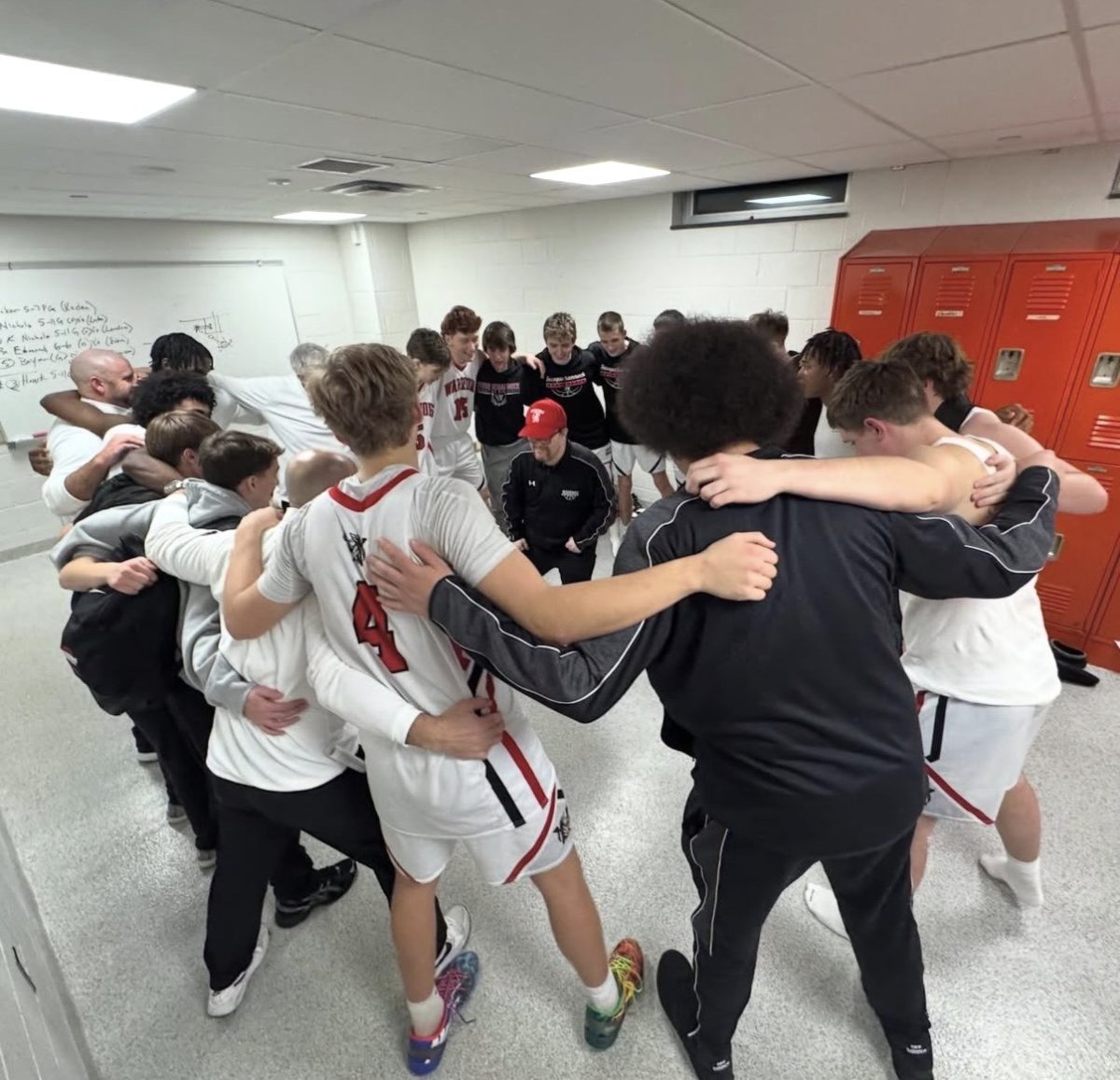 The team Manager hypes up the warriors before a game.
Photograph by Thomas Laure 
