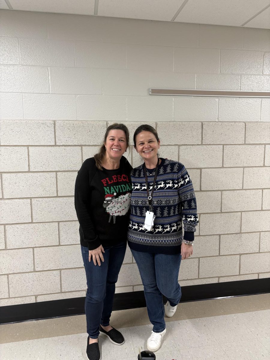 Spanish teacher Heather Walker and English teacher Erica Littleton show off their holiday-themed sweaters for one of the spirit week days. Walker and Littleton have been very good friends for more than 20 years and rarely miss a chance to be photographed together. Photograph by Caroline Simpson