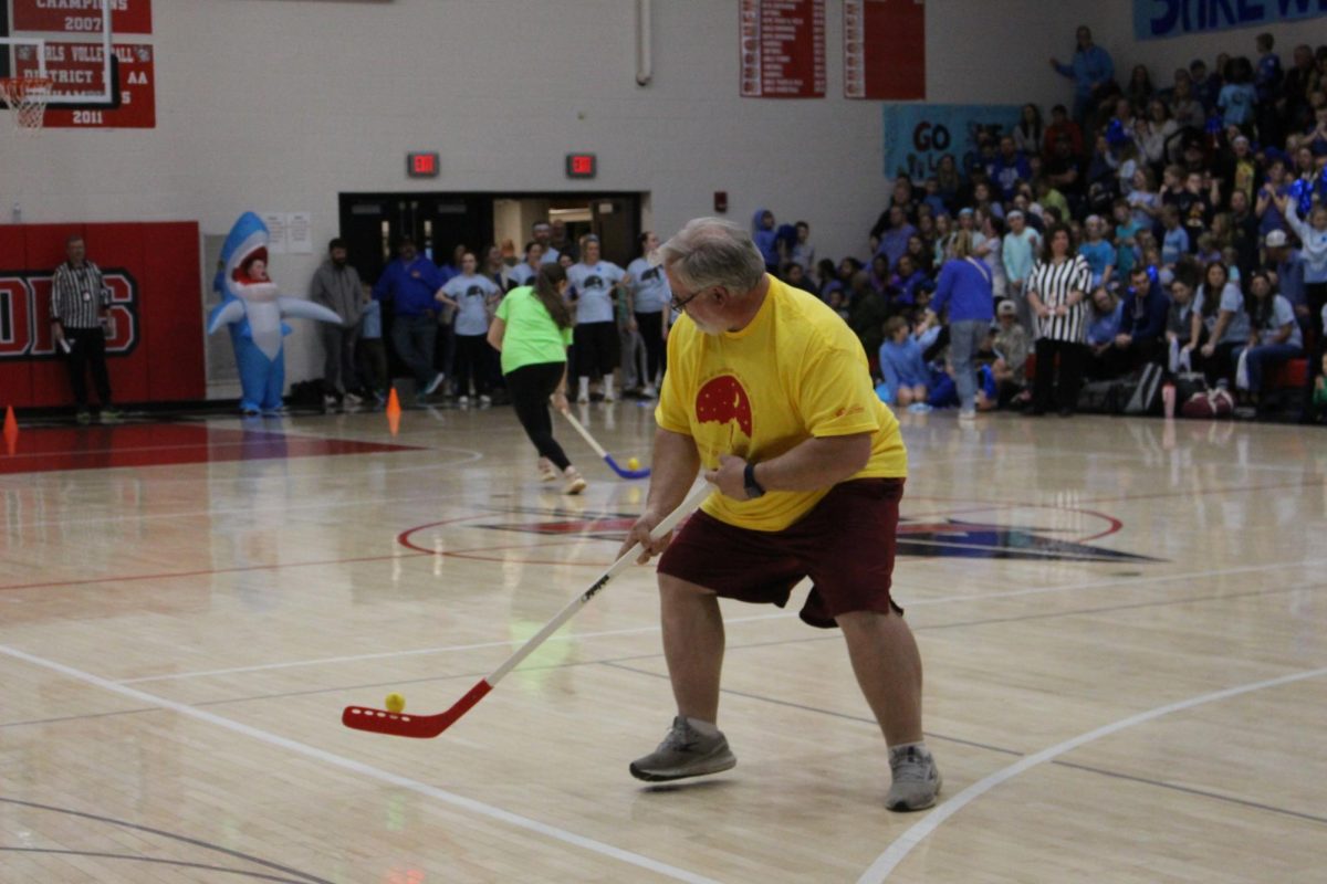 Friendship Elementary teacher Seth Catherman  pushing himself to try and finish the hockey relay.
Most participants can easily identify their favorite events. “My favorite game to participate in is the football relay,” Catherman said. “I was always good at throwing and catching the football.¨

