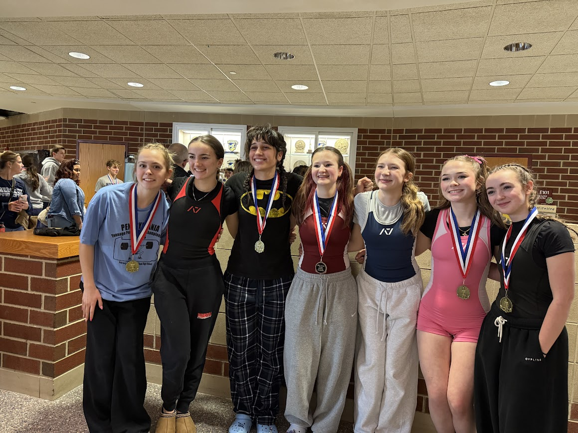 The girls powerlifting lines up with there metals
photo courtesy of Nick Deluca
