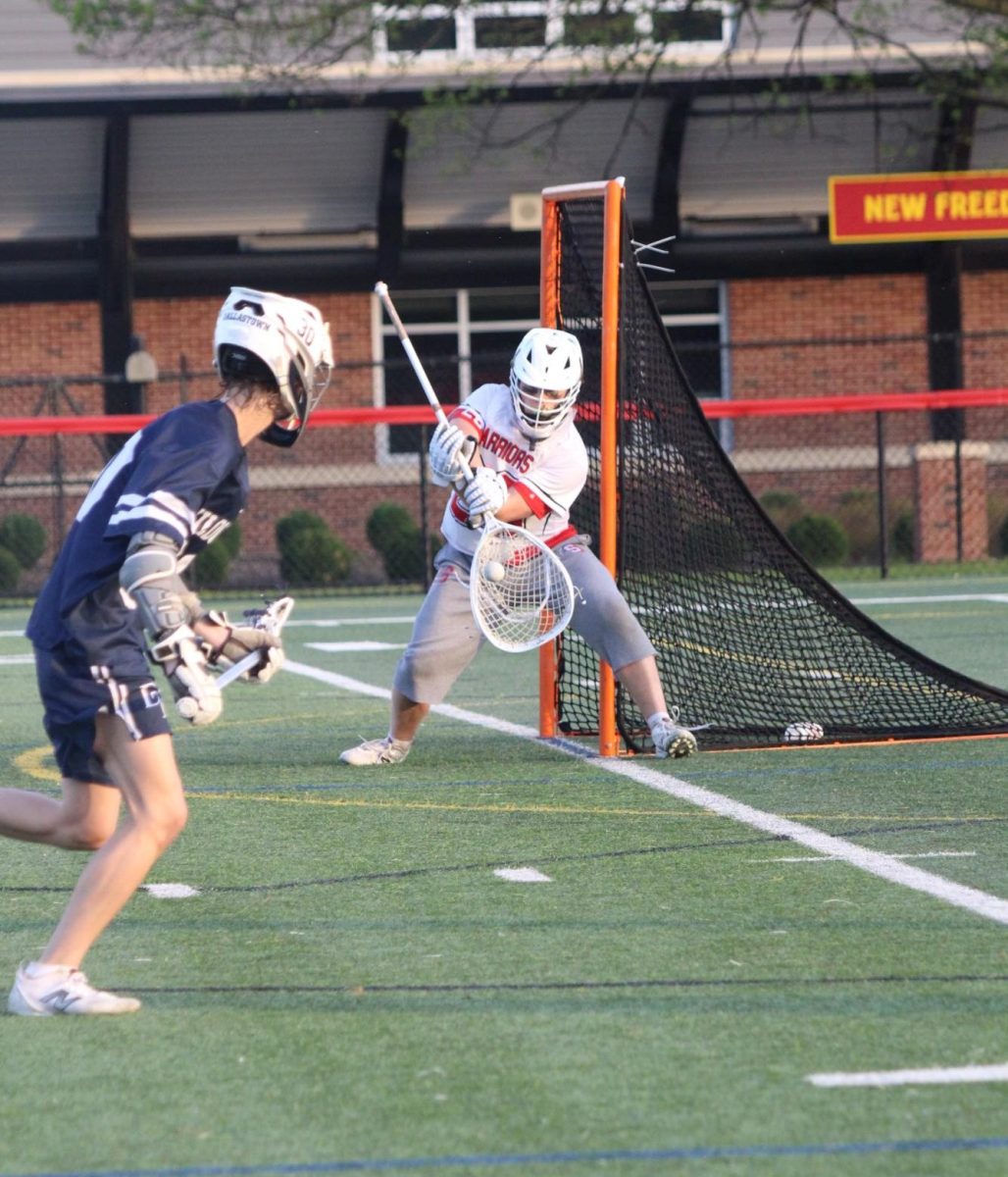Senior goalie Brady Parks stopping a vicious attack on goal. Following the Dallastown game, Parks has saved 123 goals this season. Photograph by: Allie Wolfe