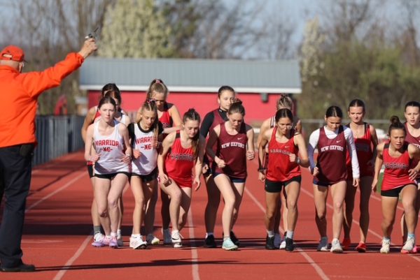 Track and Field members race during the New Oxford meet